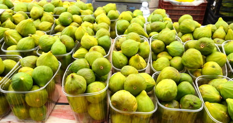 Pile of fresh organic limes at local farmers market