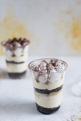 Traditional italian desert tiramisu in a jar.