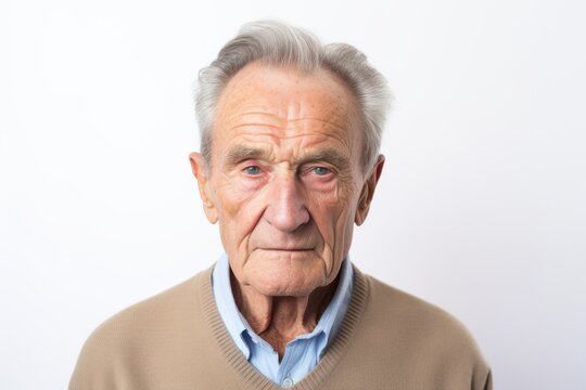 Portrait of an old man with grey hair on a white background