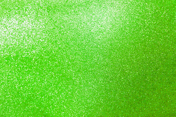 Abstract blurred green glitter texture background, shiny green glitter background