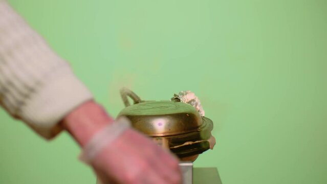 Man turns waffle iron and opens it. Man's hands take out cooked waffles from electric waffle iron. Food preparation.