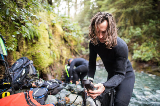 Scuba diver checks gear before a dive