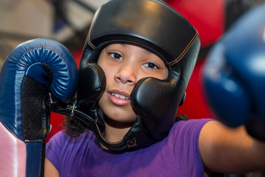 Young girls participating in a boxing clinic  at the local gym