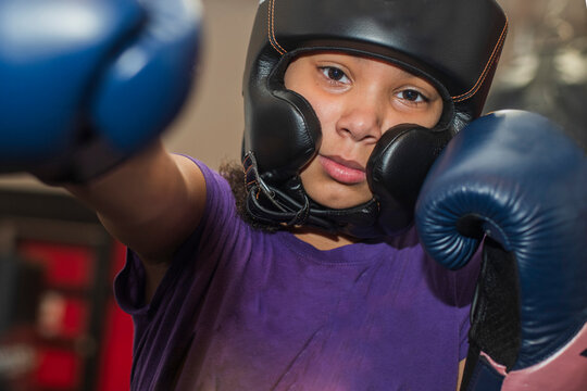 Young girls participating in a boxing clinic  at the local gym