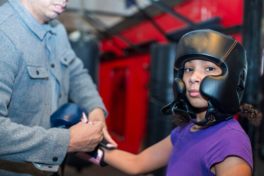 Young girls participating in a boxing clinic  at the local gym