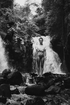 Young woman at Aling-Aling waterfall. Bali