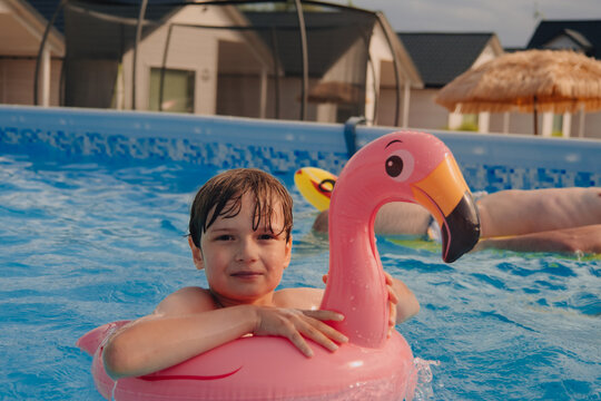 Boy happy swimming in a pool