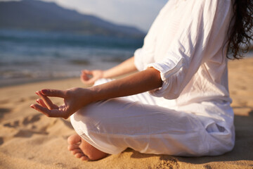 Yoga, hands and woman at beach in meditation for zen peace, wellness and mindfulness in outdoor...