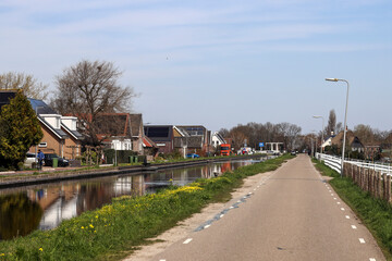 Obraz premium Westringdijk in Nieuwerkerk aan den IJssel on the ring canal where plan area Nieuwerkerk-Noord lies