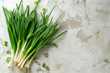 A cluster of fresh green onions neatly arranged on a wooden table