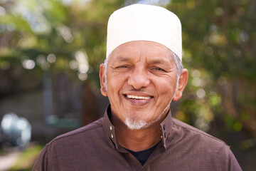 Happy, muslim and portrait of man outdoor with a smile in garden or relax on holiday in retirement....
