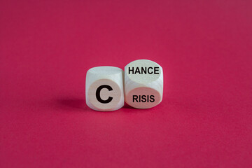 Turned a wooden cube and change wording Crisis to Chance. Beautiful red background. Mindset is important for human development. Copy space