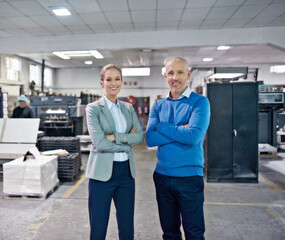 Business people, management and portrait with arms crossed in factory with confidence for career in printing industry. Mature man, woman and happiness in warehouse for inspection and collaboration