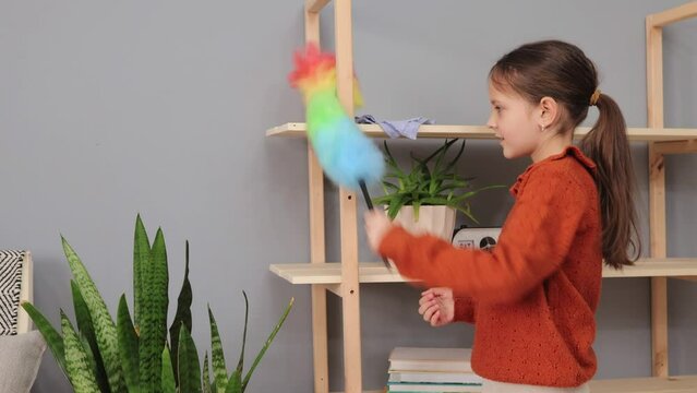 Kid's housekeeping duties. Child's cleaning responsibilities. House cleaning teamwork. Children's house chores. Little girl doing cleaning routine with pp duster wiping dust