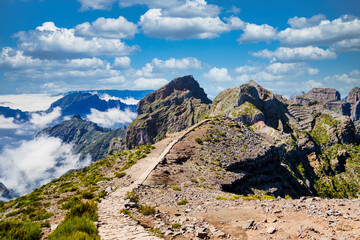 The picturesque stone trail PR 1 in Madeira. The route leads through rocky terrain, surrounded by...