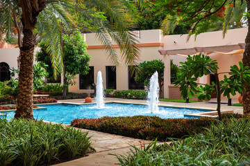 Beautiful fountain in the garden of a tropical resort