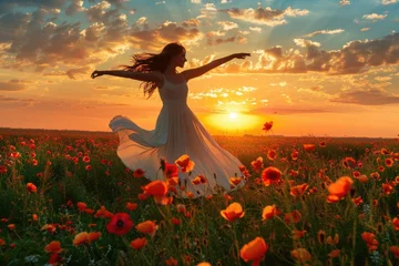 Gardinen Woman twirling in a poppy field at sunset © Lubos Chlubny
