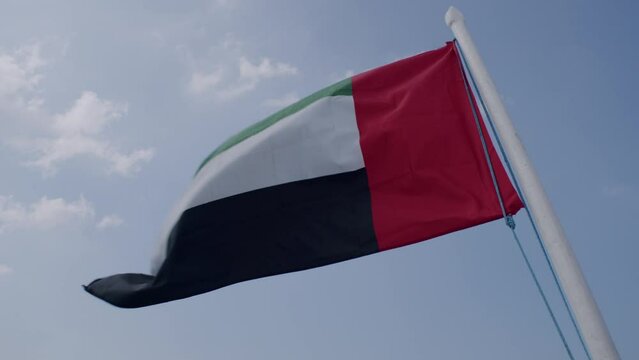 United Arab Emirates Country Flag Waving on Pole, Close Up