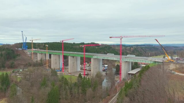 Cranes At The Highway Bridge With Reinforced Concrete Structure During Construction. - aerial shot