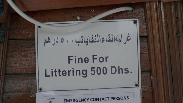 Fine For Littering 500 Dirhams, Warning Sign Board on Boat in UAE, Close Up