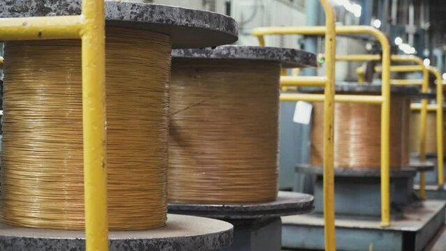 Metalworking and steel production, the process of winding and electroplating, brass and bronze wire on rolls, rotating spools metal cord.