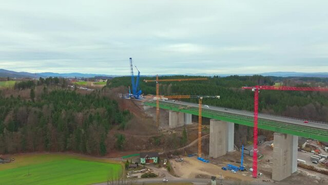 Tower Cranes At The New Highway Bridge In Austria. - aerial shot