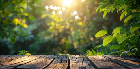 wooden table with blurred nature background, sunlight and green leaves
