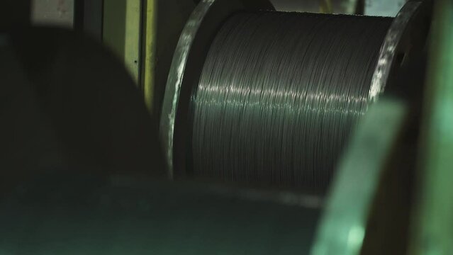 Metalworking and steel production, the process of winding and electroplating, brass wire on reels, rotating spools metal cord.