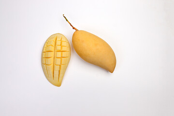 Yellow mango tropical fruit whole sliced cube diced half on white background