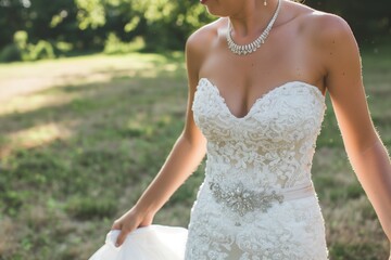 Fototapeta na wymiar bride walking, necklace sparkling with each step