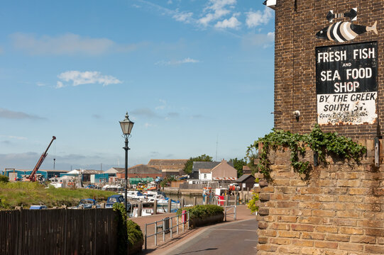 ISLE OF SHEPPEY, KENT, UK - JUNE 26, 2011: Sign advertising Fish and Sea Food shop at Queenborough beside the Harbour