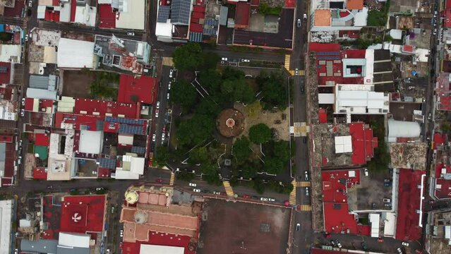 Cenital roll shot of Huajuapan de Leon's Municipal Park in Oaxaca, Mexico. We can see the city center and, the park and the cathedral.
