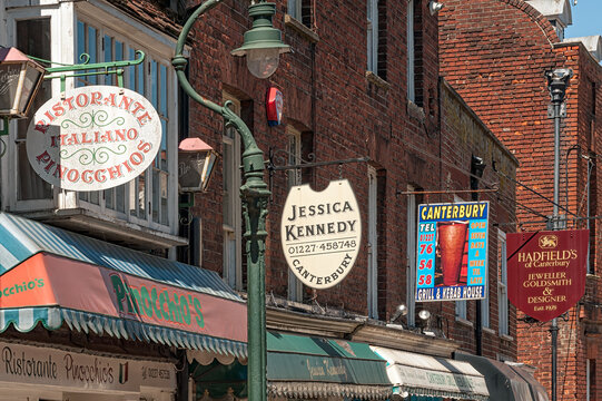 CANTERBURY, KENT, UK - JUNE 26, 2011:  Colourful shop signs in Castle Street