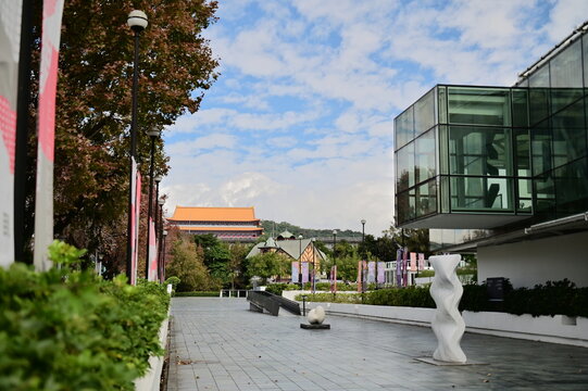 The close-up captures Taipei Fine Arts Museum's outdoor plaza in Zhongshan District, showcasing Maison ACME beside it and the iconic Grand Hotel in the distance.