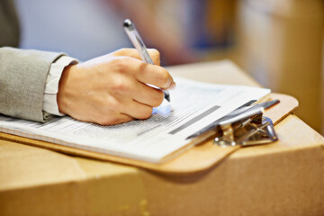 Inspector, clipboard and closeup of hand writing in warehouse for inventory, quality control and...