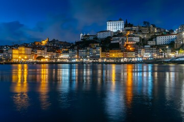 Fototapeta na wymiar Night skyline of Porto, Portugal, on the banks of the Douro River, cityscape at night.