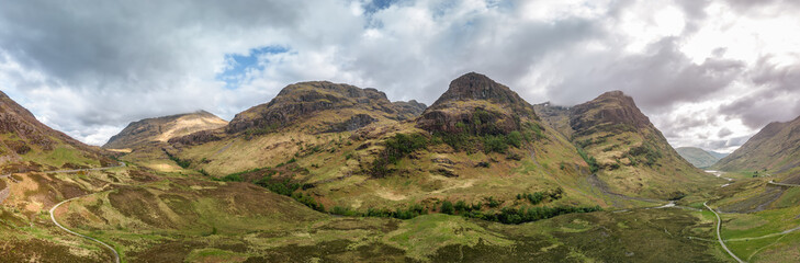 The vastness of the Glen Coe valley is on full display in this drone captured super panorama, with the Three Sisters towering above, their slopes a tapestry of Scottish wilderness