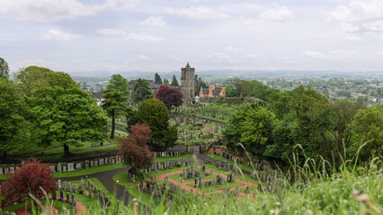 A sweeping panorama captures the serene Church of the Holy Rude Cemetery in Stirling, Scotland,...