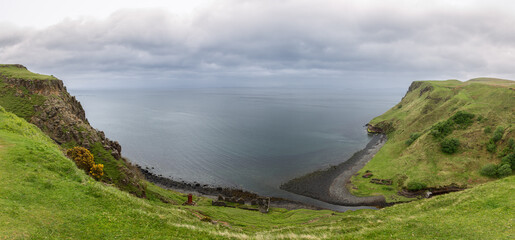 This sweeping panorama captures the dramatic coast near Lealt Falls on the Isle of Skye, where...