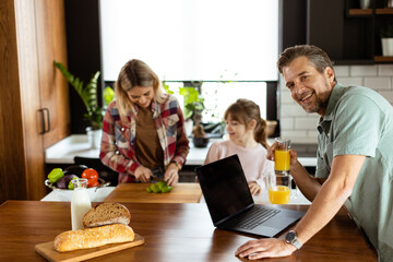 Family Bonding Over Breakfast in a Sunny Kitchen During a Leisurely Morning. Generative AI - 768597737
