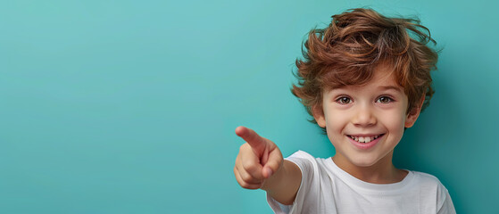 cute smiling boy pointing five with empty space for text over teal background