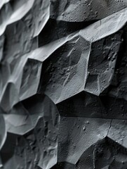 A detailed closeup of the textured surface of a black minimalist homes exterior wall, the subtle variations in shade and texture set against a white background to illustrate the material beauty and ta