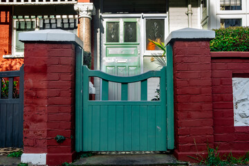 LONDON-  Green gate at entrance of typical residential house in Fulham, west London