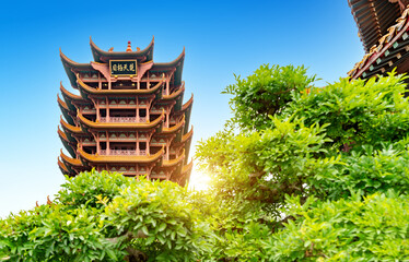 Yellow crane tower against blue sky in wuhan, China, the four Chinese characters mean "As far as you can see in Hubei".