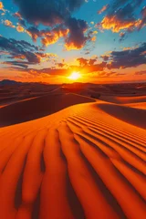 Wall murals Red A breathtaking desert landscape basks in the orange glow of the setting sun with rippling sand dunes stretching towards the horizon under a vivid sky.