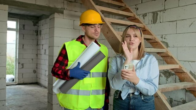 Team of building specialists inspecting apartment under construction