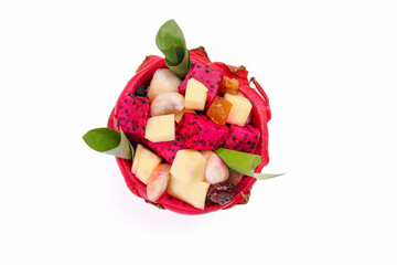 Beautiful Mangosteen mango dragon fruit cube fruit salad in dragon fruit skin bowl on white background - 768620932