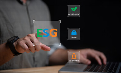 ESG environment social governance investment business concept,Asian man sitting using a computer to analyze ESG,Environment world day.