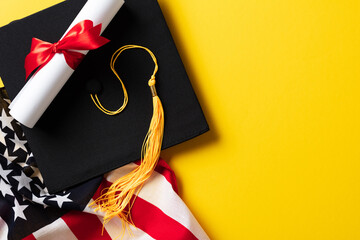 Graduation cap and diploma with American flag on white background. Graduation party concept.