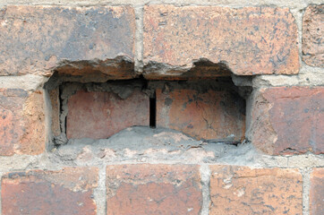 Close Up of hole in Old Brick Wall  